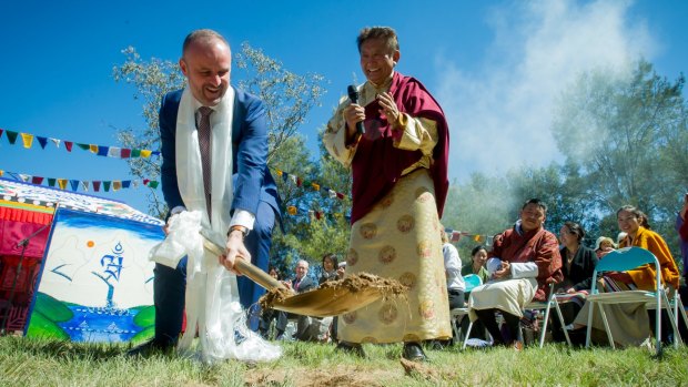Chief Minister Andrew Barr and the spiritual leader Lama Choedak Rinpoche turn the first sod at the Stupa Temple of Peace, at Jenke Circut, Kambah. 