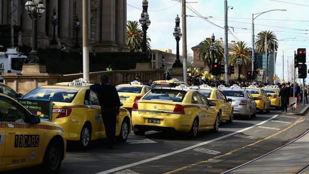 Taxis block the road outside the Victorian Parilaiment.