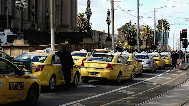 Taxis block the road outside the Victorian Parilaiment.