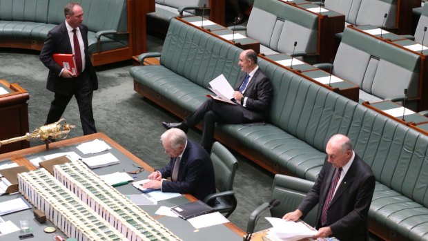 Deputy Nationals leader Barnaby Joyce walks in to join fellow frontbenchers Andrew Robb Minister, Stuart Robert and Deputy Prime Minister Warren Truss.