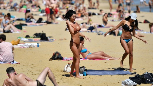 People enjoy hot weather at St Kilda beach in November this year. 