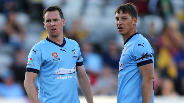 Tough time: Sydney FC duo Shane Smeltz and Filip Holosko played with heavy hearts against Central Coast on Saturday.
