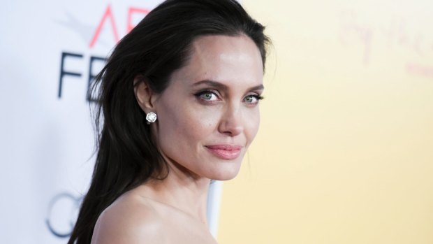 Single life is tough, but Angelina Jolie keeps a brave face in front of the children.