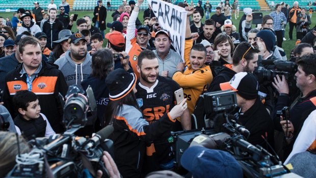 Fan favourite: Robbie Farah is mobbed by supporters after playing a NSW Cup match.