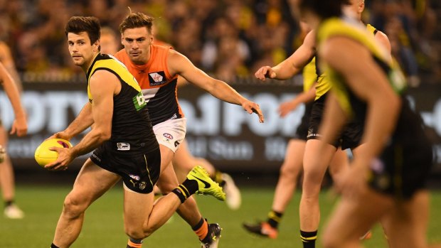 Bruising: Trent Cotchin faces a nervous wait after making head-high contact with Dylan Shiel.