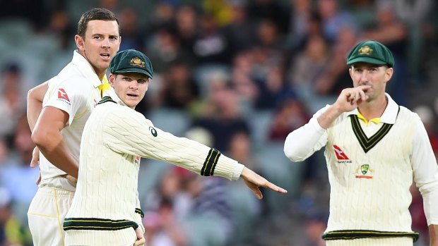 Vain appeal: Josh Hazlewood and Shaun Marsh look on Steve Smith requested a DRS review to dismiss England captain Joe Root.