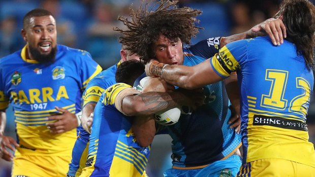 Hair-raising: The Eels defence grapples with Kevin Proctor.