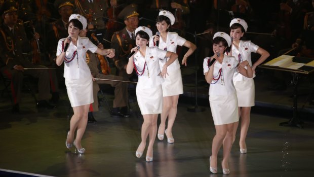 Members of North Korea's Moranbong Band sing and dance during a joint performance with the State Merited Chorus in Pyongyang, North Korea in October.