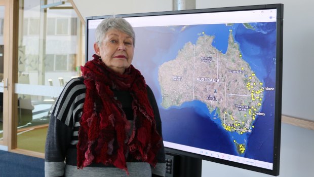 Historian Professor Lyndall Ryan in front of an online mapping project for Aboriginal massacres.