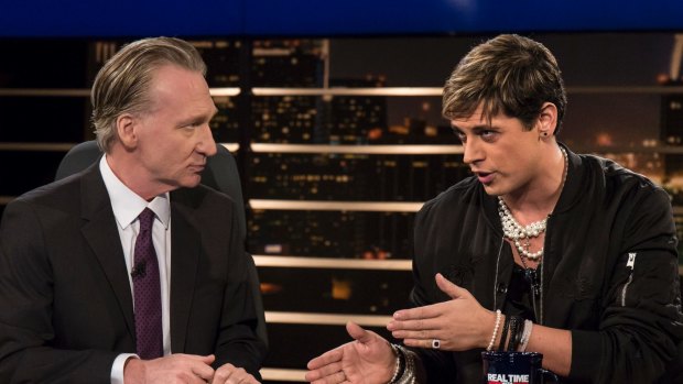 Bill Maher, left, listens to Milo Yiannopoulos, a writer for Breitbart News, on HBO's "Real Time with Bill Maher"