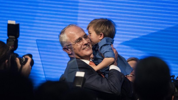 Prime Minister Malcolm Turnbull with his grandson Jack after addressing the party at the national Liberal party campaign rally in Homebush, Sydney.