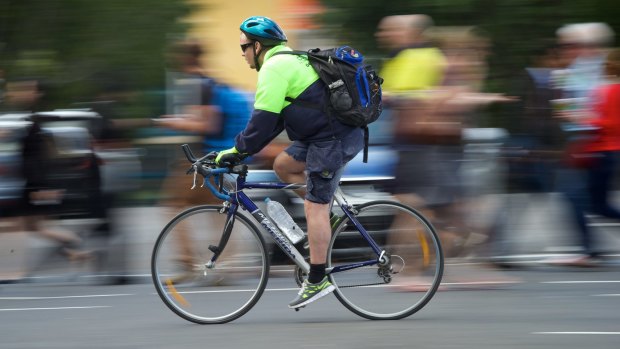 Fast lane: a cyclist rolls through Sydney.. 