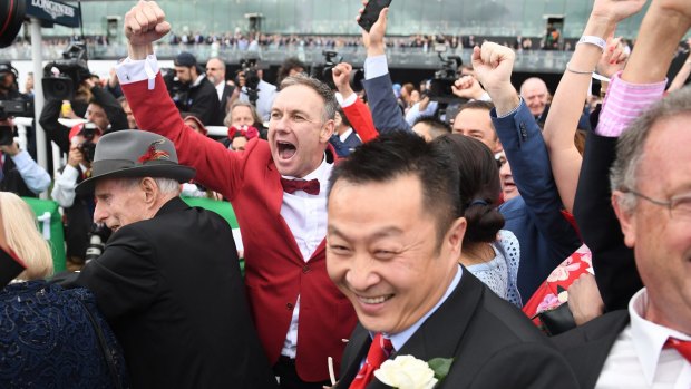 Sky's the limit: Owners and fans celebrate Redzel's win.