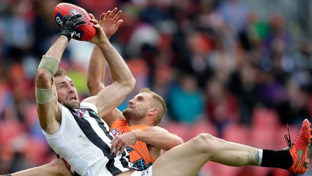 Cloke, wearing the glove on his right hand, takes a mark over Joel Patfull.