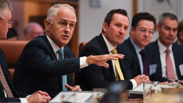 Prime Minister Malcolm Turnbull sits next to WA Premier Mark McGowan at the COAG meeting.