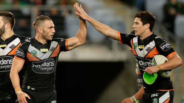 Former allies: Robbie Farah and Mitchell Moses together during their time at Wests Tigers.