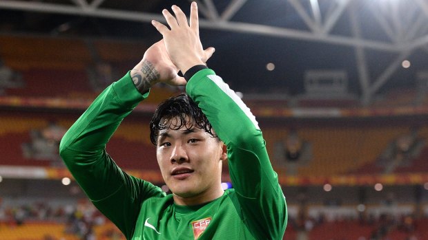 Tournament of his life: Wang Dalei celebrates victory over Uzbekistan at Suncorp Stadium.