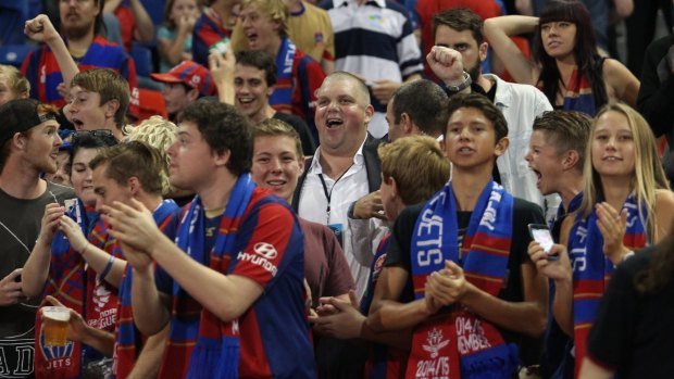 Punters pal: Nathan Tinkler with Newcastle Jets fans last Friday night.