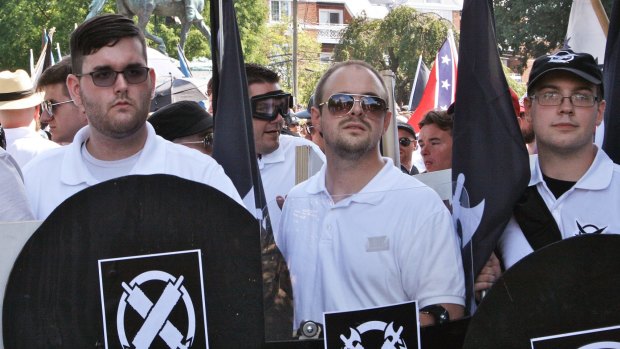 James Alex Fields jnr, left, holds a black shield at the rally in Charlottesville.
