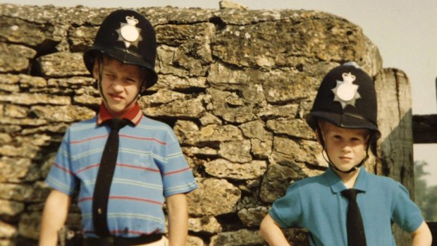Prince William, left, and Prince Harry wear policemen outfits in a photo  featured in the new documentary.
