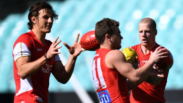 Recovering: Kurt Tippett, left, expects to be fit for the Swans' first final.