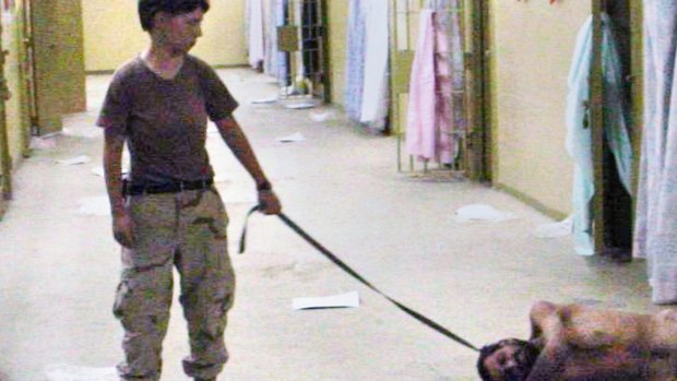 A US soldier with a naked detainee at the Abu Ghraib prison in Baghdad.