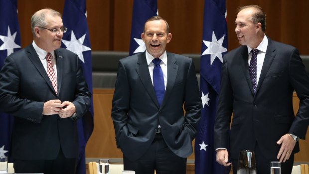 Mr Morrison, Mr Abbott and Mr Dutton laugh at the joke.