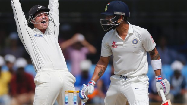 Under review: New Zealand keeper BJ Watling appeals against Virat Kohli who now tentatively supports using DRS.