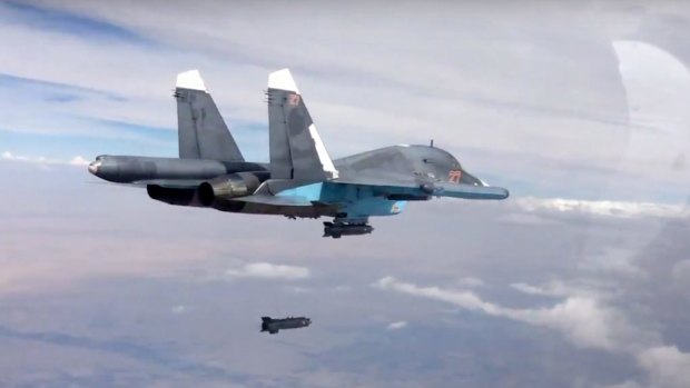 A bomb is released from a Russian Su-34 strike fighter in Syria.