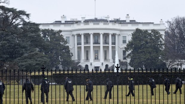 Increasingly challenged: Secret Service officers search the south grounds of the White House in Washington after an unmanned aerial drone was found on the White House grounds during the middle of the night  in 2015.