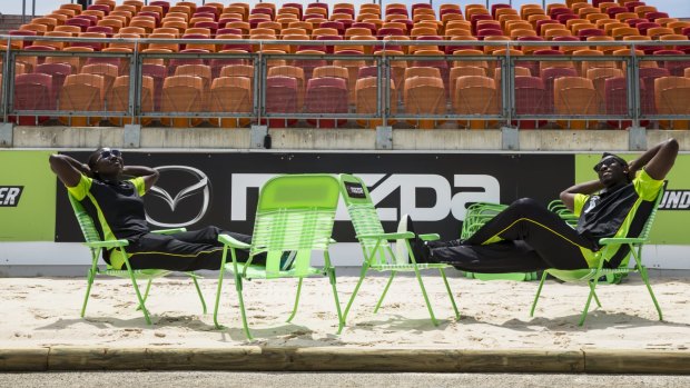 Andre Russell and Stefanie Taylor take five on the beachside chairs at Spotless Stadium.  