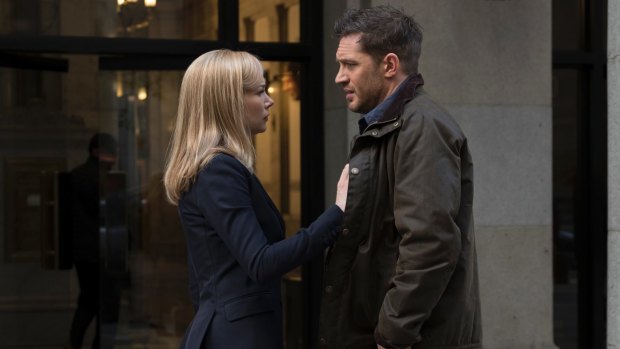Michelle Williams and Tom Hardy in a scene from Venom.