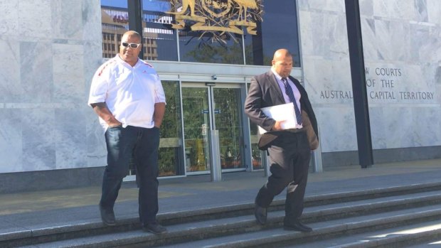 Halafihi "Fihi" Kivalu, left, leaves the ACT Supreme Court on Thursday with his lawyer Toni Tu'ulakitau, right