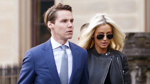Oliver Curtis with wife Roxy Jacenko arrives at St James Supreme Court on Wednesday for his insider trading trial.