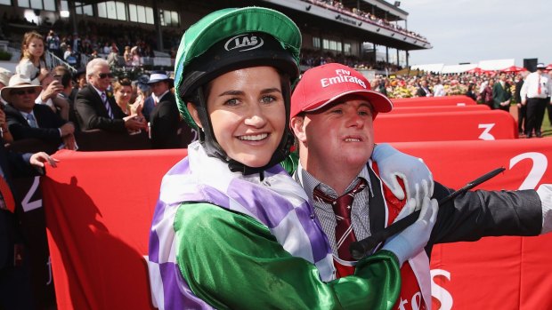 Michelle Payne celebrates her winning ride on Prince Of Penzance to win race 7 the Emirates Melbourne Cup.