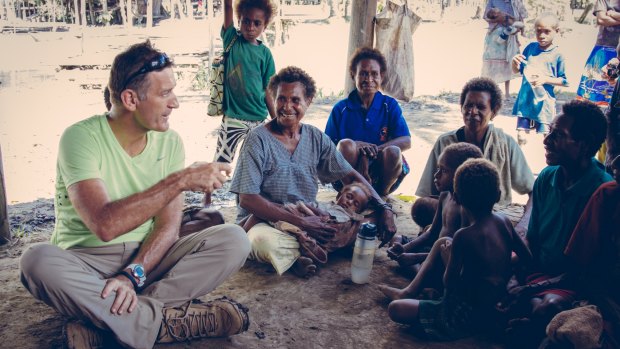 Michael Hession, the chief executive of InterOil with Papuan villagers.