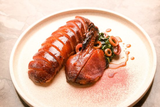 Dry-aged roast duck with quandong, black cabbage and bamboo.