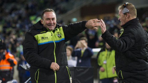 Raiders' coach Ricky Stuart celebrates the final try with assistant coach Mick Crawley.