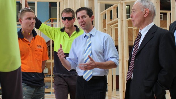 Bob Day, right, at North East Vocational College with Simon Birmingham in 2015.