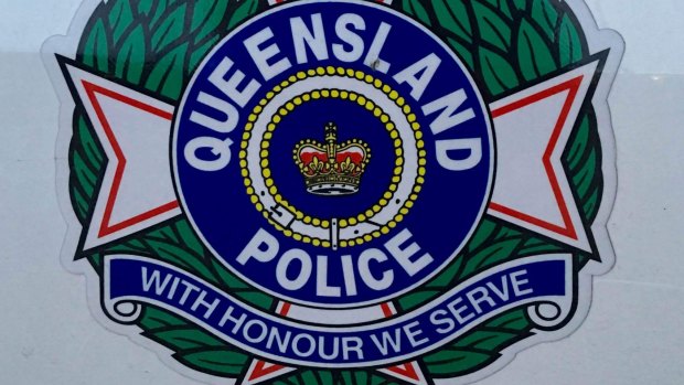 Police say a man raised a metal bar towards officers after walking down a street in Wishart on Saturday night hitting letterboxes, bus stops and fences with it.