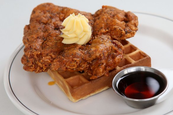 Fried chicken and waffle with whipped butter and bourbon-spiked maple syrup.