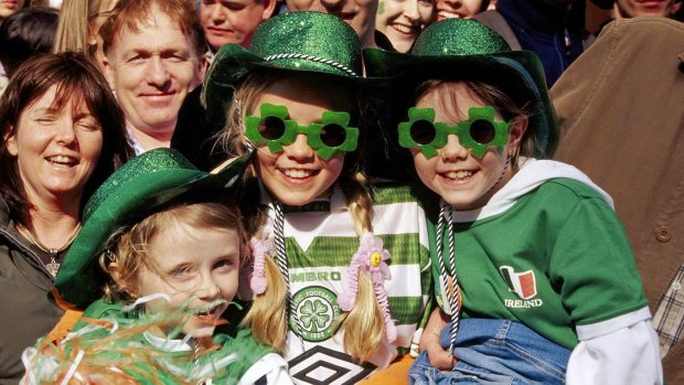 Kids get into the festival spirit while waiting for the St Patrick's Day parade in Dublin. 