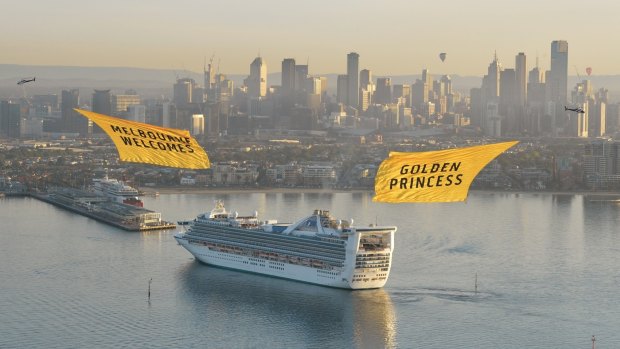 Banner-wielding helicopters welcome the Golden Princess to Melbourne.