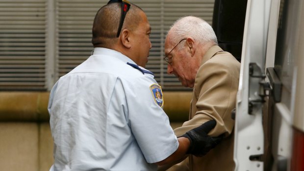 Roger Rogerson is escorted to the NSW Supreme Court for his murder trial: he blames his co-defendant Glen McNamara.