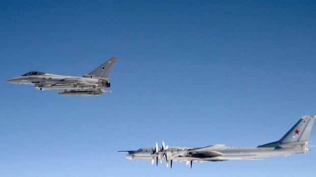 A British RAF Typhoon from Number XI Squadron RAF Coningsby in Lincolnshire shadows a Russian Bear-H bomber over the North Atlantic Ocean in 2007.