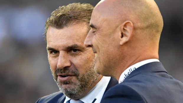 Ange Postecoglou with Victory coach Kevin Muscat on Saturday.