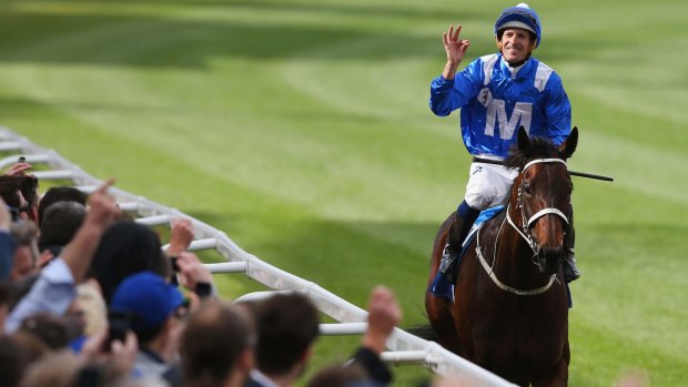 Champion: Hugh Bowman riding Winx returns to scale after winning the Cox Plate in October.