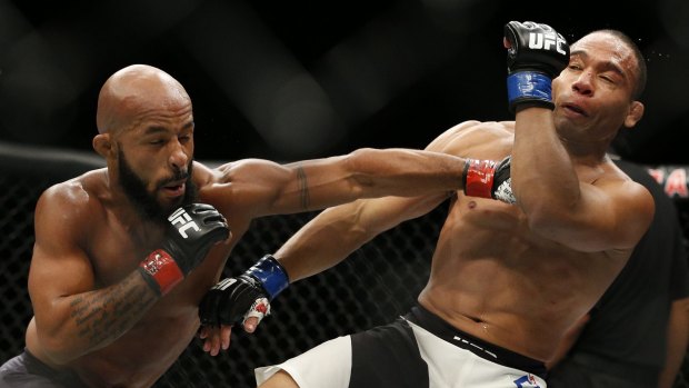 Demetrious Johnson hits John Dodson during their flyweight title mixed martial arts bout at UFC 191 earlier this month.