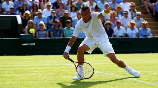 Wimbledon farewell: Lleyton Hewitt of Australia bows out against Jarkko Nieminen of Finland.