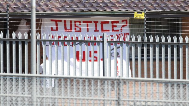 A protest flag is displayed at Villawood detention centre in 2010.